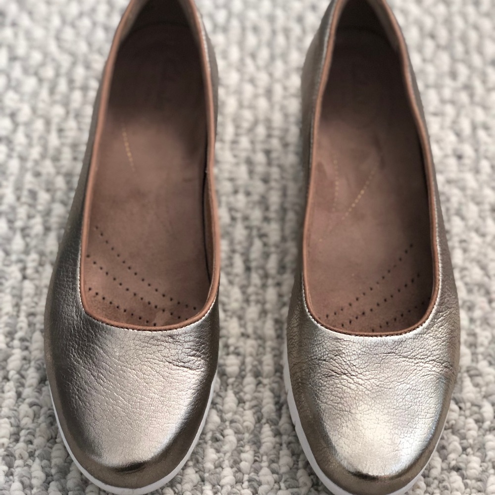 Clark’s gold comfort flats
